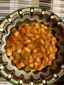 A decorative bowl filled with Bop, a tomato-based white bean dish, made by Rebecca Ivanoff.