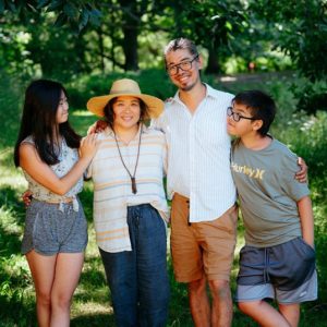Farmers Judy and Hans, alongside their children at Paper Kite Farm