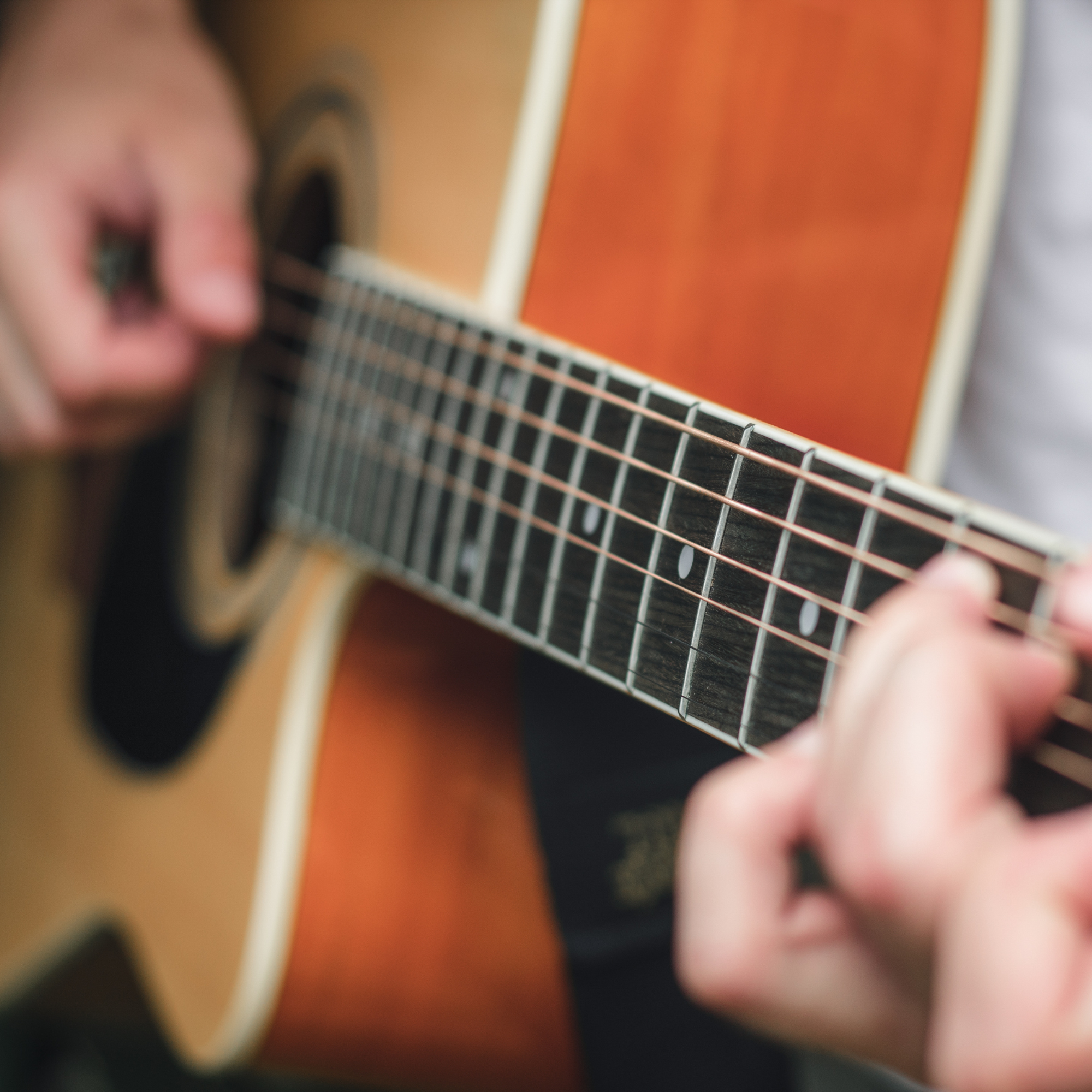 Photo of someone playing the guitar