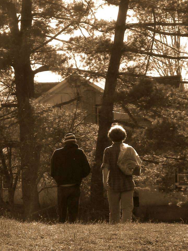 two men walking away from the camera at Wiseacres Farm